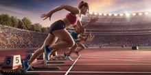 Female Athletes Sprinting. Three Women In Sport Clothes Run At The Running Track In Professional Stadium