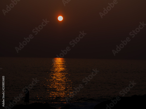 黄金岬の夕日と女性 北海道の留萌にて Stock Photo Adobe Stock