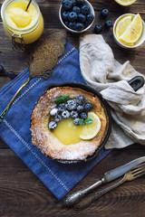 Wall Mural -  Dutch Baby pancake with lemon curd and blueberries