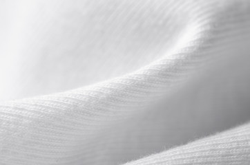 White warm fabric texture material sweater on blur background