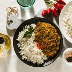 Wall Mural - Basmati rice with curry from vegetables and lentils. Healthy spicy vegan food.