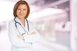 © BillionPhotos.com - Young female doctor with stethoscope on blurred hospital