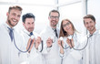 © ASDF - group of doctors hold their stethoscopes