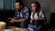 © motortion - Daughter and father playing video game with joysticks together home, having fun