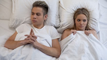 Embarrassed And Shy Young Couple Before First Intimacy In Bed, Inexperience
