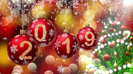 Wall Mural - red balls with numbers 2019 hanging on the background of a gold bokeh and a rotating christmas tree 