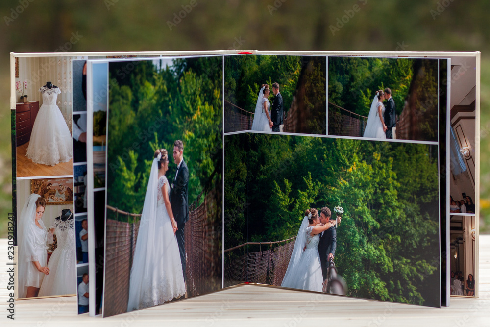 Open pages of brown luxury leather wedding book or album - obrazy, fototapety, plakaty 