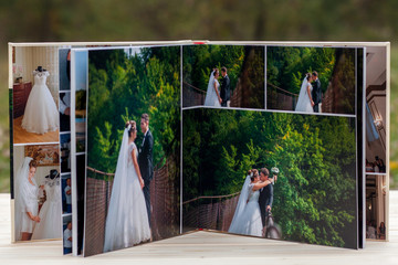 open pages of brown luxury leather wedding book or album