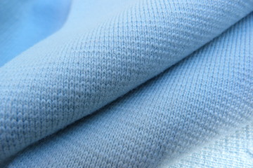 blue knitwear closeup wool acrylic soft fabric drapery background macro textile