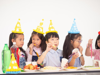 group of kids celebrate party and enjoy christmas fun together,Children are exchanging gifts.