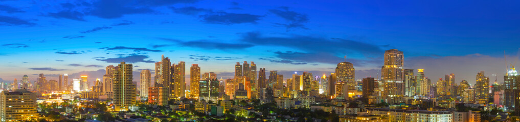  Panorama of modern high building of bangkok business city center at twilight. Picture for add text message. Backdrop for design art work.