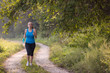© .shock - woman jogging along a country road