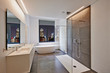 © pbombaert - Bathtub in corian, Faucet and shower in tiled bathroom
