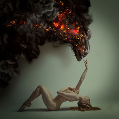 Wall Mural - duality and danger concept, classic ballet dancer lying down with elegant and delicate poses and a fiery monster over in menacing pose, halloween