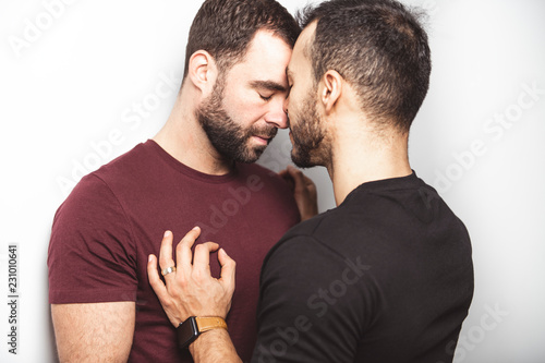 Young homosexuals gay couple love each other on a white background Tapéta, Fotótapéta