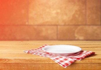 White Plate on napkin on wooden table