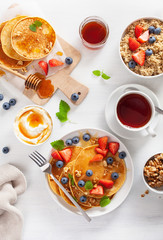 pancakes with blueberry strawberry honey and quinoa for breakfast