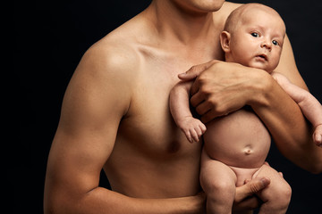 nude baby being prepared to take a shower. close up cropped photo.