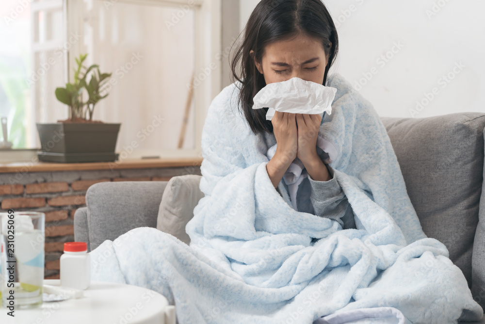 Sick day at home. Asian woman has runny and common cold. - obrazy, fototapety, plakaty 