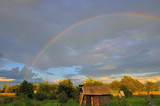 Fototapeta Tęcza - A beautiful full rainbow in the old village
