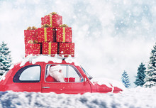Santa Claus On A Red Car Full Of Christmas Present With Winter Background Drives To Deliver