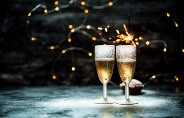 two glasses of champagne on dark, romantic, calm background