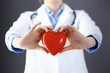 © rogerphoto - Female doctor with stethoscope holding heart in her arms. Healthcare and cardiology concept  in medicine