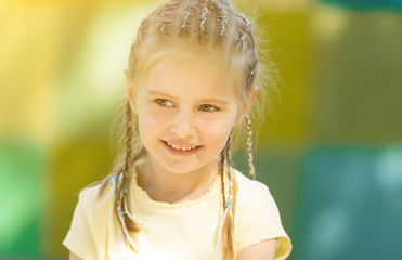 cute little girl smiling in the morning park