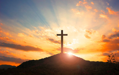 Wall Mural - christmas concept: crucifixion of jesus christ cross at sunset