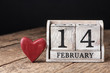 © nata777_7 - Wooden calendar show of February 14. Red heart.