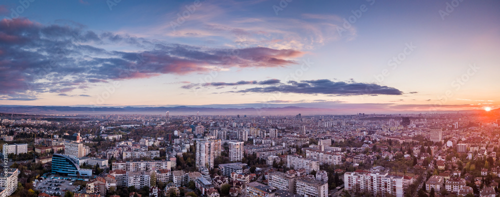 Obraz na płótnie Beautiful drone shot of a vivid sunrise over Sofia, Bulgaria - impressive image with colourful skies and amazing aerial views over the city. w salonie