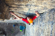 © zhukovvvlad - Climber in a helmet climbs up.