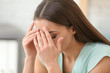 © Pixel-Shot - Woman suffering from headache indoors