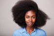 © mimagephotos - Close up portrait of beautiful young black woman with afro hair staring