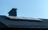 Fototapeta  - Solar panels on the roof of the house