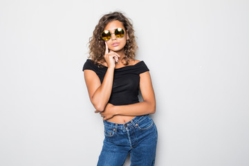 Portrait of young curlu american girl in sunglasses isolated on white background