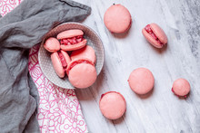 Pink macarons filled with raspberry buttercream