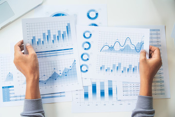 Wall Mural - businessman working data document graph chart report marketing research development planning managem