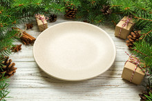Perspective View. Empty Plate Round Ceramic On Wooden Christmas Background. Holiday Dinner Dish Concept With New Year Decor