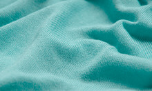 The Texture Of A Knitted Woolen Fabric Turquoise.