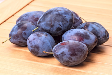 Wall Mural - Pile of plums on the table