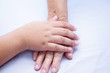 © amazing studio - Kid children holding Touching hands Asian senior or elderly old lady woman patient with love, care, helping, encourage and empathy at nursing hospital ward : healthy strong medical concept