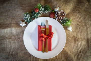 White dish with cutlery and christmas decoration