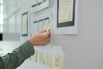 user experience ux designer designing web on mobile phone tablet layout. ui planning mobile applicat