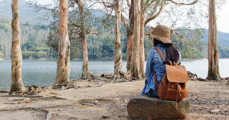 Wall Mural - woman enjoy the view of the lake