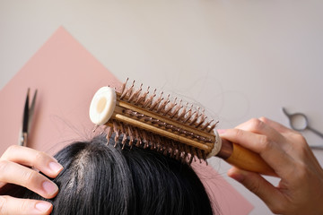 Wall Mural - hair fall and lost alopecia woman problem on the comb.