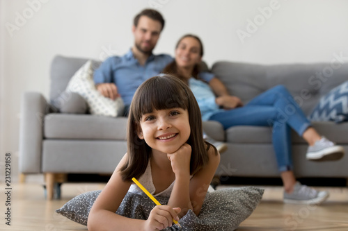 Family In Living Room Looking At Camera At Home Close Up Focus On