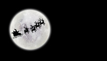 Santa Flying Over Full Moon