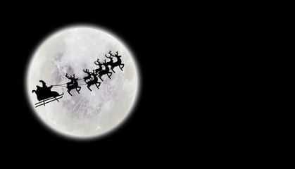 santa flying over full moon