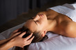 Head and face massage in spa salon